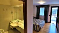Łóżko lub łóżka w pokoju w obiekcie Hotel Luna