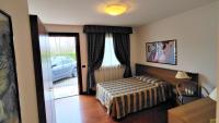 Łóżko lub łóżka w pokoju w obiekcie Hotel Luna