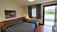 Łóżko lub łóżka w pokoju w obiekcie Hotel Luna