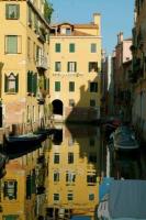 a reflection of buildings in the water of a canal at Hotel Ca&#39; D&#39;Oro in Venice