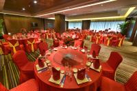 a banquet hall with red tables and red chairs at Park Plaza Beijing Wangfujing in Beijing