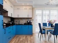 Kuchyň nebo kuchyňský kout v ubytování Apartament Porto Santa Rewales