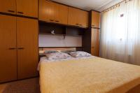 Postel nebo postele na pokoji v ubytování Apartments Nedeljka
