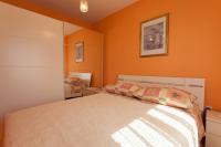 Postel nebo postele na pokoji v ubytování Apartments Nedeljka