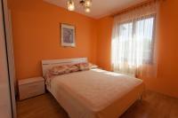Postel nebo postele na pokoji v ubytování Apartments Nedeljka