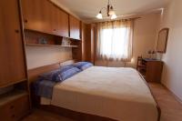 Postel nebo postele na pokoji v ubytování Apartments Nedeljka