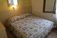 Posteľ alebo postele v izbe v ubytovaní Agriturismo La Fraterna
