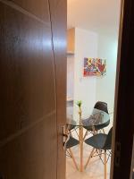 a dining room with a glass table and chairs at Residencial Havaí in João Pessoa