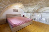 A bed or beds in a room at Case vacanza Assunta a Melendugno