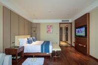 Postel nebo postele na pokoji v ubytování Yushan Town Tianji Cloud Business Hotel