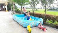 two young boys playing in a inflatable pool at Jane Castle in Wujie