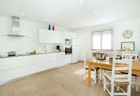 A kitchen or kitchenette at Owl Booking Villa Vallori - 5 Min Walk to the Beach