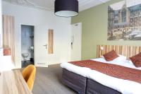Hotel Asterisk, a family run hotelにあるベッド