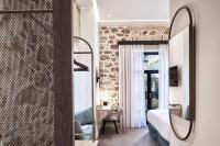 Televízia a/alebo spoločenská miestnosť v ubytovaní NLH MONASTIRAKI - Neighborhood Lifestyle Hotels