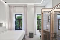 Posteľ alebo postele v izbe v ubytovaní NLH MONASTIRAKI - Neighborhood Lifestyle Hotels