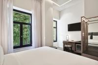 Posteľ alebo postele v izbe v ubytovaní NLH MONASTIRAKI - Neighborhood Lifestyle Hotels