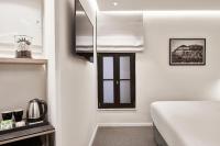Posteľ alebo postele v izbe v ubytovaní NLH MONASTIRAKI - Neighborhood Lifestyle Hotels