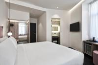 Posteľ alebo postele v izbe v ubytovaní NLH MONASTIRAKI - Neighborhood Lifestyle Hotels