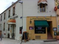 a building with a sign in front of it at Les Pastels in La Roche-sur-Yon