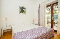 Postel nebo postele na pokoji v ubytování Apartments Robert