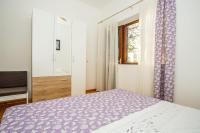 Postel nebo postele na pokoji v ubytování Apartments Robert