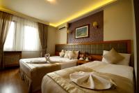 Postel nebo postele na pokoji v ubytování Anzac Hotel