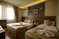 Postel nebo postele na pokoji v ubytování Anzac Hotel