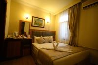 Postel nebo postele na pokoji v ubytování Anzac Hotel