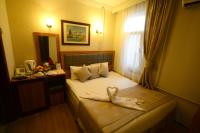 Postel nebo postele na pokoji v ubytování Anzac Hotel
