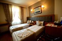 Postel nebo postele na pokoji v ubytování Anzac Hotel