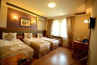 Postel nebo postele na pokoji v ubytování Anzac Hotel