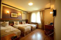 Postel nebo postele na pokoji v ubytování Anzac Hotel