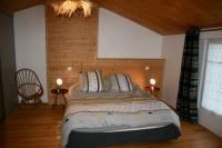 a bedroom with a bed with two tables and two lamps at Loc5c in Noirmoutier-en-l&#39;lle