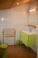 a bathroom with a green sink and a green toilet at Loc5c in Noirmoutier-en-l&#39;lle