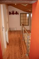 an empty room with a wooden floor and stairs at Loc5c in Noirmoutier-en-l&#39;lle