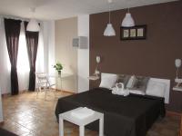 A bed or beds in a room at El Manantial