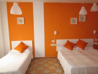 A bed or beds in a room at El Manantial
