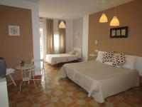 A bed or beds in a room at El Manantial