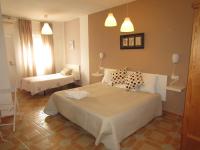 A bed or beds in a room at El Manantial