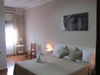 A bed or beds in a room at El Manantial