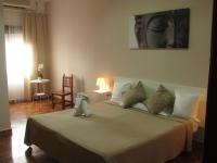 A bed or beds in a room at El Manantial