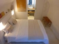Ein Bett oder Betten in einem Zimmer der Unterkunft le tilleul