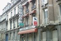 a sign for a hotel on the side of a building at Ardenn&#39;Hotel in Reims