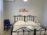 Posteľ alebo postele v izbe v ubytovaní B&B Antichi Cortili