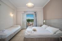 Postel nebo postele na pokoji v ubytování Georgia Apartments