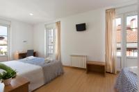 Postel nebo postele na pokoji v ubytování Hostal La Numantina