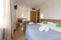 Postel nebo postele na pokoji v ubytování Hostal La Numantina
