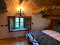A bed or beds in a room at Casa Ferreiro - Campo da Cruz - Lugo