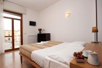 A bed or beds in a room at Leccesalento Bed And Breakfast