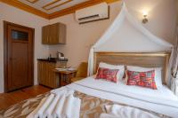 Postel nebo postele na pokoji v ubytování April Hotel